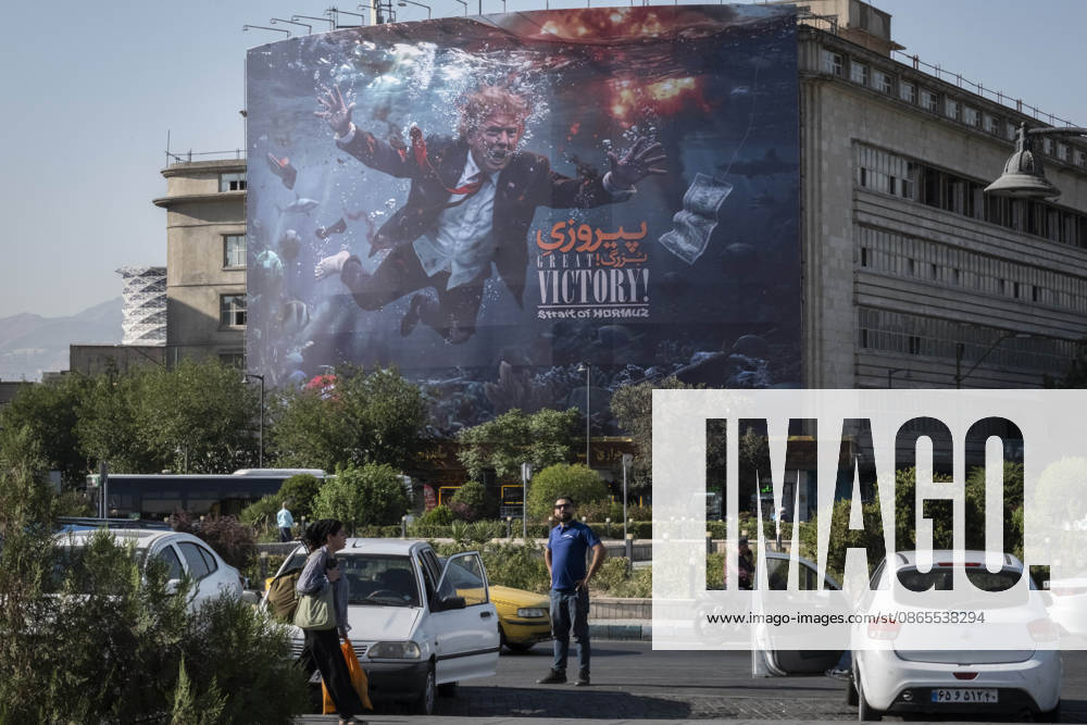 Anti Trump New Billboard In Tehran An Iranian man stands beneath a billboard featuring President Donald Trump and the slogan Great Victory, Strait of Hormuz in southern Tehran, Iran, on September 1, 2026. U.S. forces struck two Iranian military launchers on Larak Island in the Strait of Hormuz on August 30, the first reported U.S. attack on Iranian territory since late July. Tehran Tehran Iran