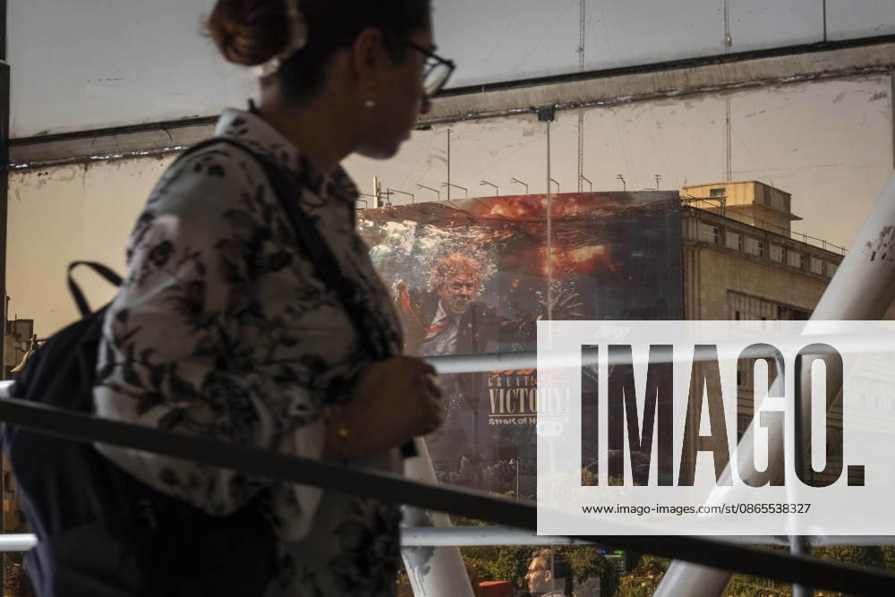 Anti Trump New Billboard In Tehran A young Iranian woman walks past a billboard featuring President Donald Trump and the slogan Great Victory, Strait of Hormuz in southern Tehran, Iran, on September 1, 2026. U.S. forces struck two Iranian military launchers on Larak Island in the Strait of Hormuz on August 30, the first reported U.S. attack on Iranian territory since late July. Tehran Tehran Iran