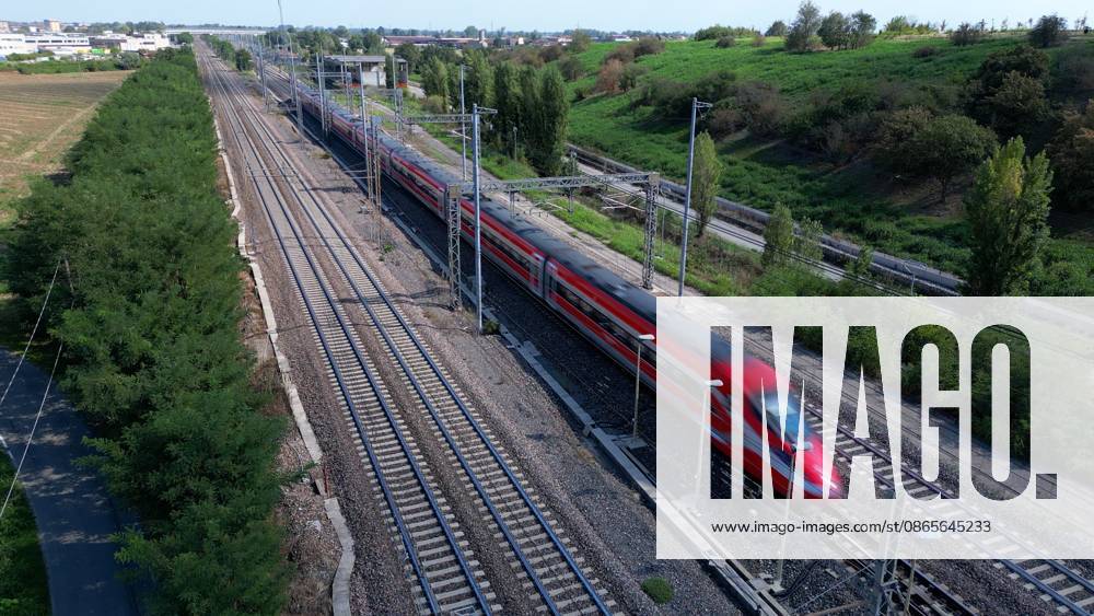 IPA88029779 - Italy, Milan drone footage of the Milan Rome high-speed railway (Frecciarossa Italo) and Intercity regional trains Italian Railways