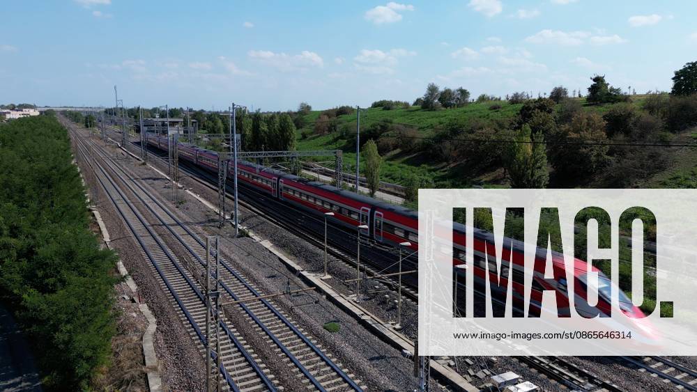 IPA88029734 - Italy, Milan drone footage of the Milan Rome high-speed railway Frecciarossa Italo and Intercity regional trains Italian Railways