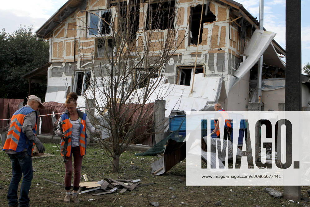 Two people injured in Russian drone attack on Dnipro residential area Municipal workers and local residents clear debris from the yard of a private house damaged by Russian shelling in one of the districts of Dnipro, Ukraine, on September 1, 2026. The Russian attack damaged private houses, a business, and a school stadium. Two women, aged 58 and 63, were hospitalized with injuries, Credit:Mykola Miakshykov Ukrinform Avalon Ukraine, Dnipro