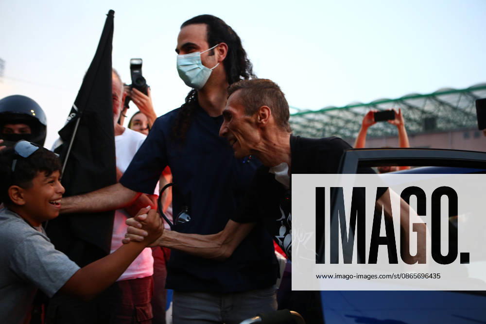 Aristotelis Chantzis shakes hands with a young boy as he steps out of a car upon his return to the Prosfygika housing complex in Athens following his release from Evangelismos Hospital. Athens Greece - ZUMAx103 20260902_zip_x103_008