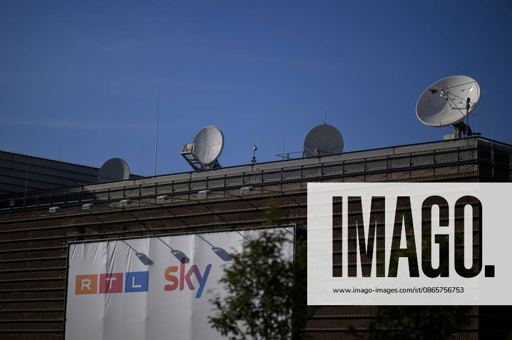 RTL Deutschland headquarters at Rheinpark Metropole, featuring a banner with the RTL and Sky logos and a satellite dish on the roof, on August 26, 2026, in Cologne, Germany