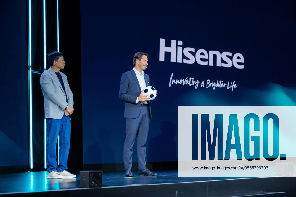 Hisense Press Conference at IFA Germany, Berlin, on September 3, 2026. Hanson Han, CEO of Hisense Europe, and Guillaume Sabran, Chief of Sponsorship and Licensing at UEFA, holding a soccer ball. Hisense is an official sponsor of the 2028 UEFA Euro soccer tournament in the UK and Ireland.