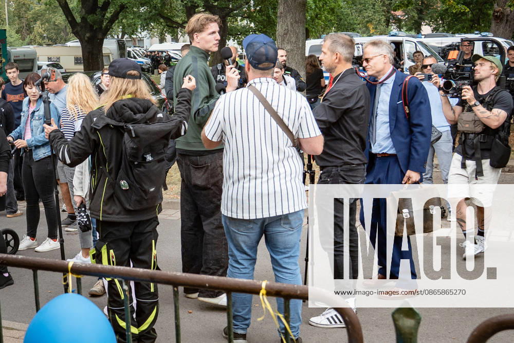 YouTuber and streamer Matthäus Westfal, known as the activist Man in the Blue Cap, Marcant in the green jacket, and Sebastian Weber, known as Weichreite TV in the black cap, on the sidelines of the AfD Democracy Festival campaign event in Haldensleben for the 2026 Saxony-Anhalt state election, Haldensleben, Saxony-Anhalt, Germany; the Schützenhaus of the Schützengilde