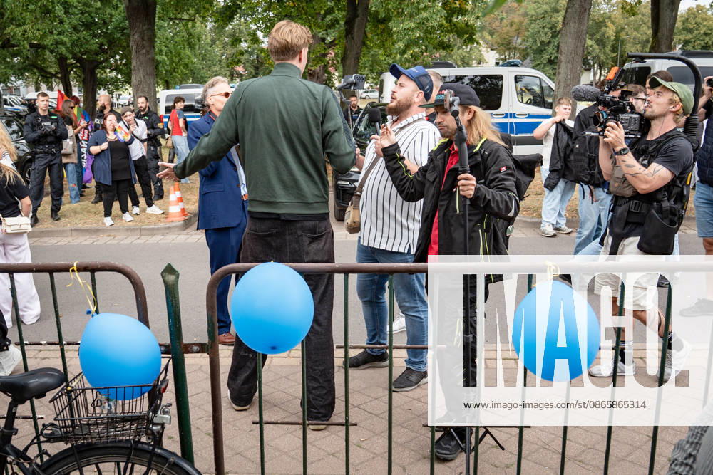 YouTuber and streamer Matthäus Westfal, known as Activist in the Blue Cap and Marcant in the Green Jacket, and Sebastian Weber, known as Weichreite TV in the Black Cap, on the sidelines of the AfD Democracy Festival campaign event in Haldensleben for the 2026 Saxony-Anhalt state election, Haldensleben, Saxony-Anhalt, Germany; the Schützenhaus of the Schützengilde