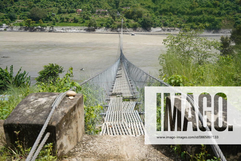 A suspension bridge over the Trishuli River damaged by flood originating from the Nepal-Tibet border area. Local residents are facing difficulties due to the damage to this bridge. Nuwakot Nepal - ZUMAa308 20260904_znp_a308_003