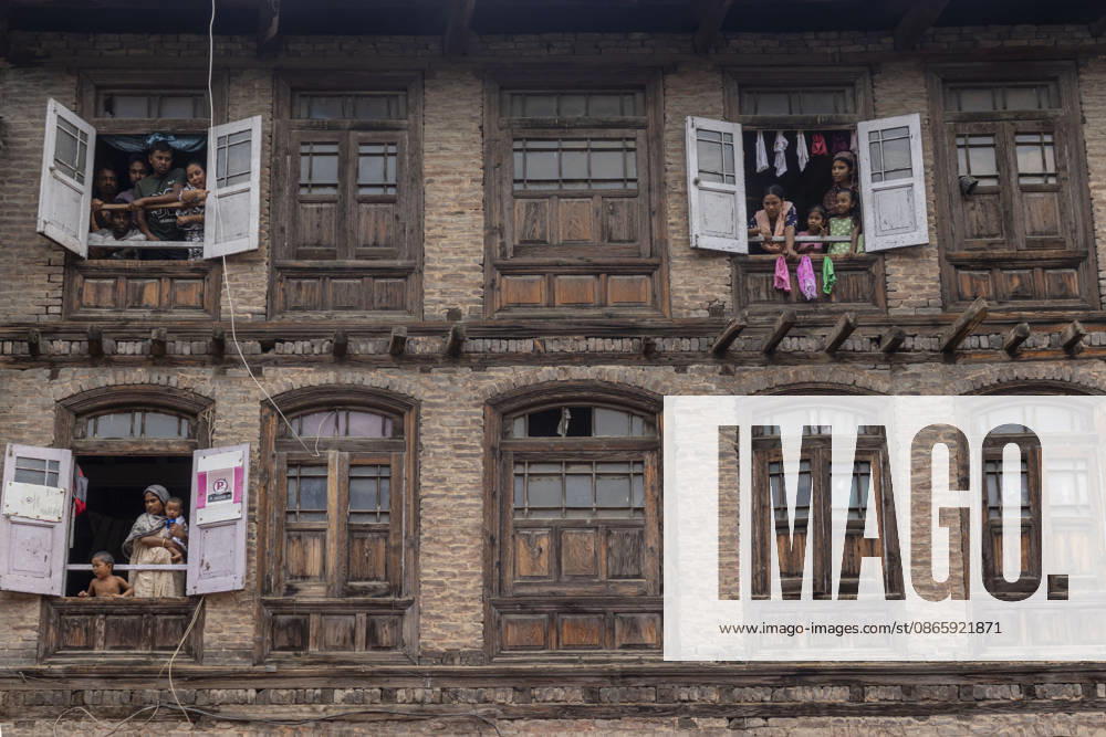 People watch the Janmashtami procession, marking the birth of the Hindu god Krishna, from the windows of a traditional residential building in Srinagar, the summer capital of Indian Kashmir. Srinagar India - ZUMAf191 20260904_zip_f191_006