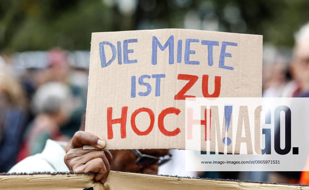 Rent Protest: Protester holding a sign reading The rent is too high during a demonstration against high rents and gentrification and in favor of expropriating housing cooperatives; thousands of people protested in Berlin on September 5, 2026, Berlin, Berlin, Germany