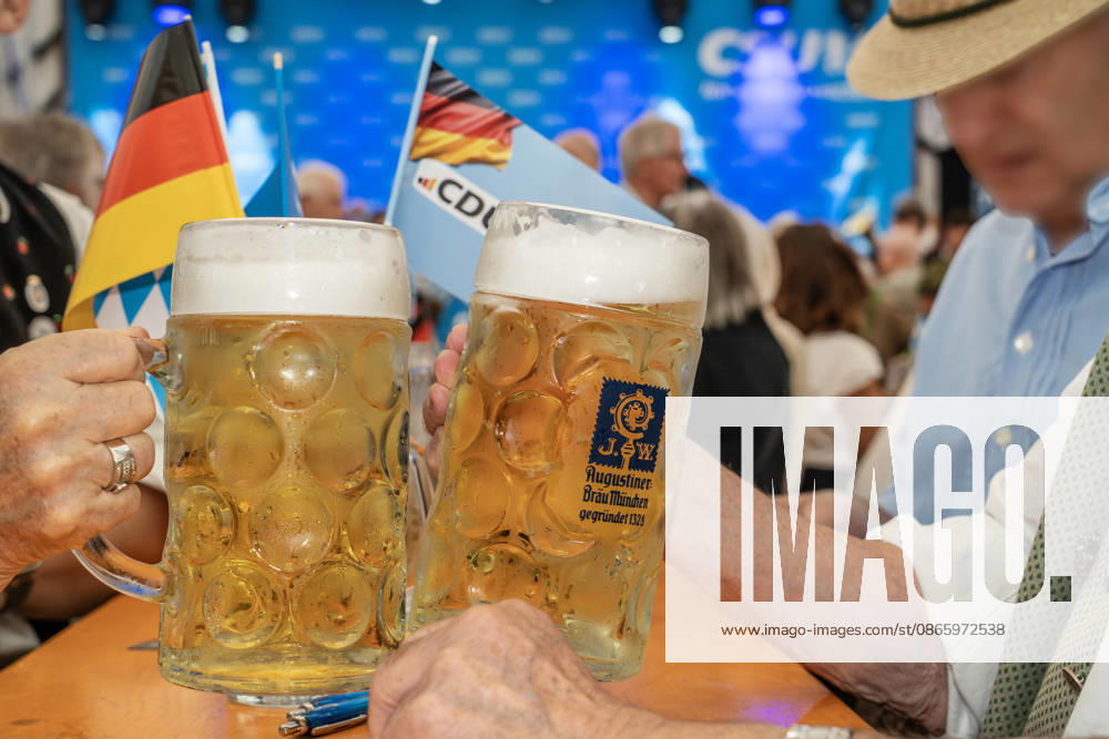 Visitors clink glasses with two Maß of Radler at the CSU Munich West Political Morning Beer Gathering, Aubing Autumn Festival, festival tent, Munich, September 5, 2026; Germany, Munich, September 5, 2026, Visitors toast each other with two Radler Maß at the CSU Mu