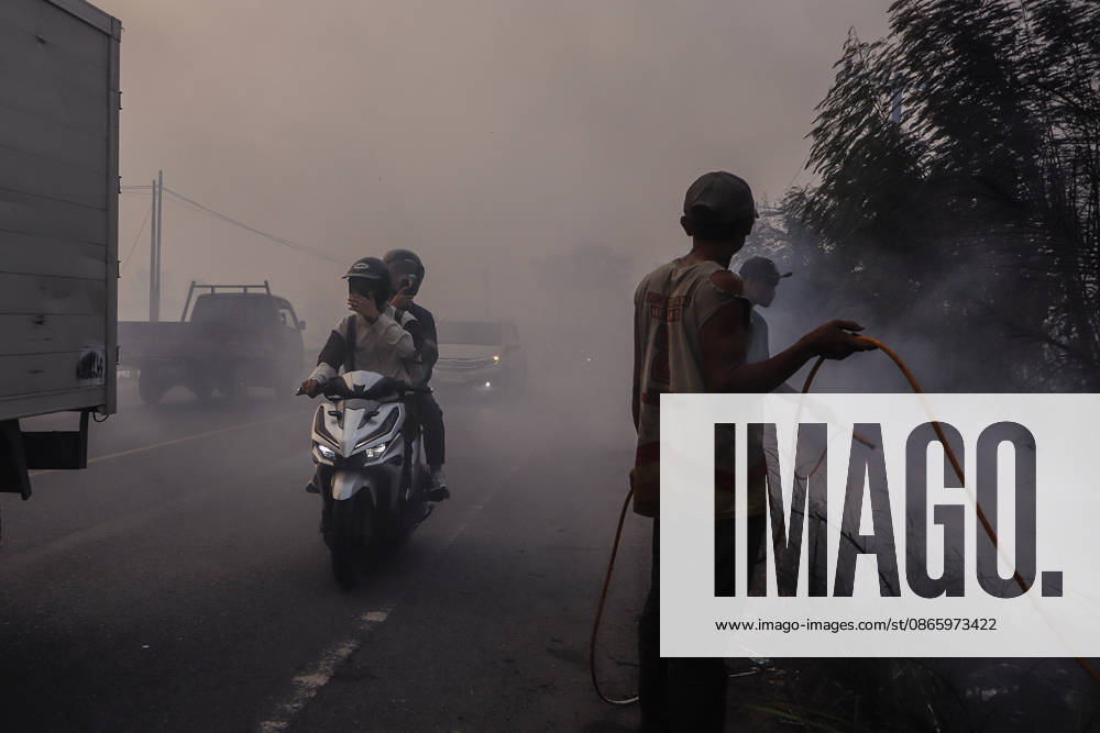 Forest and Peatland Fire in Ogan Ilir, South Sumatra A resident rides a motorcycle through the haze along the Palembang - Inderalaya Highway in South Sumatra, Indonesia, on September 5, 2026. South Sumatra Indonesia