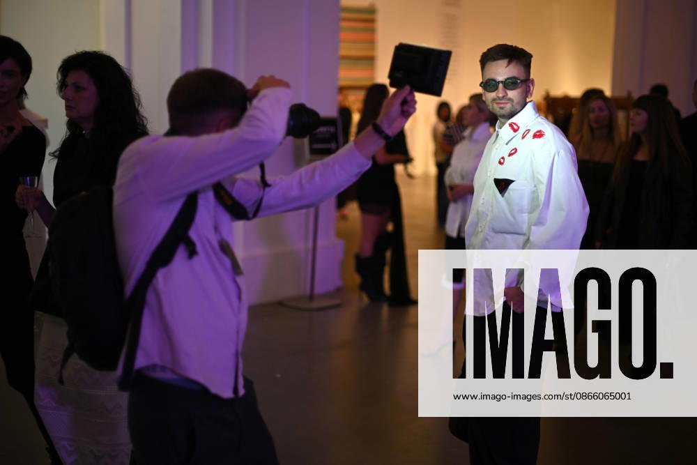 A photographer uses a LED light source to take a picture of a guest during Ukrainian Fashion Week SS27 at the Mystetskyi Arsenal National Cultural, Art and Museum Complex, Kyiv, Ukraine, September 5, 2026. (Photo by Yevhen Kotenko Ukrinform) Guests visit Ukrainian Fashion Week SS27 in Kyiv