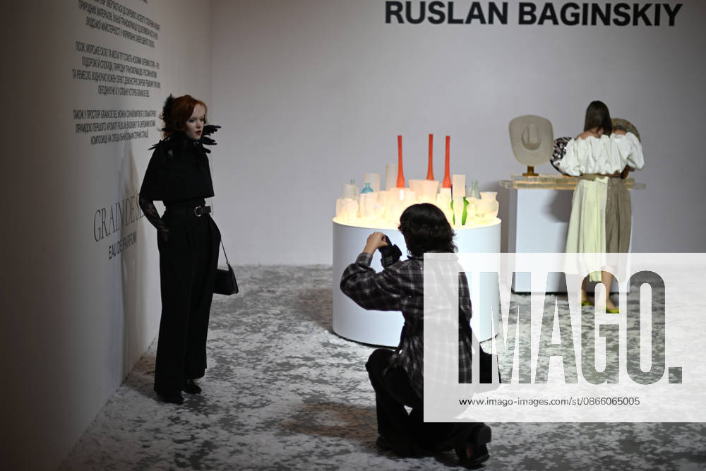 A woman poses at the stand of the Ukrainian headwear brand Ruslan Baginskiy, presenting the debut unisex perfume Grain de Sel, during Ukrainian Fashion Week SS27 at the Mystetskyi Arsenal National Cultural, Art and Museum Complex, Kyiv, Ukraine, September 5, 2026. (Photo by Yevhen Kotenko Ukrinform) Guests visit Ukrainian Fashion Week SS27 in Kyiv