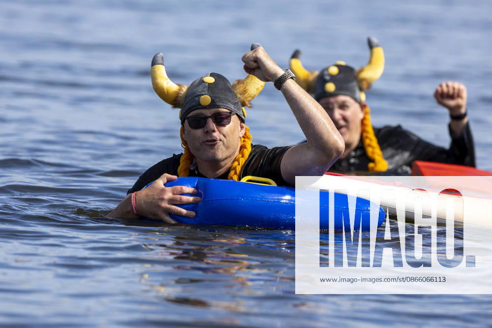 24 Elbe Swim Strehla 24 Elbe Swim Strehla 55 participants, some wearing quirky costumes, swim in the waters of the Elbe River in Strehla, Saxony, Germany Daniel Wagner