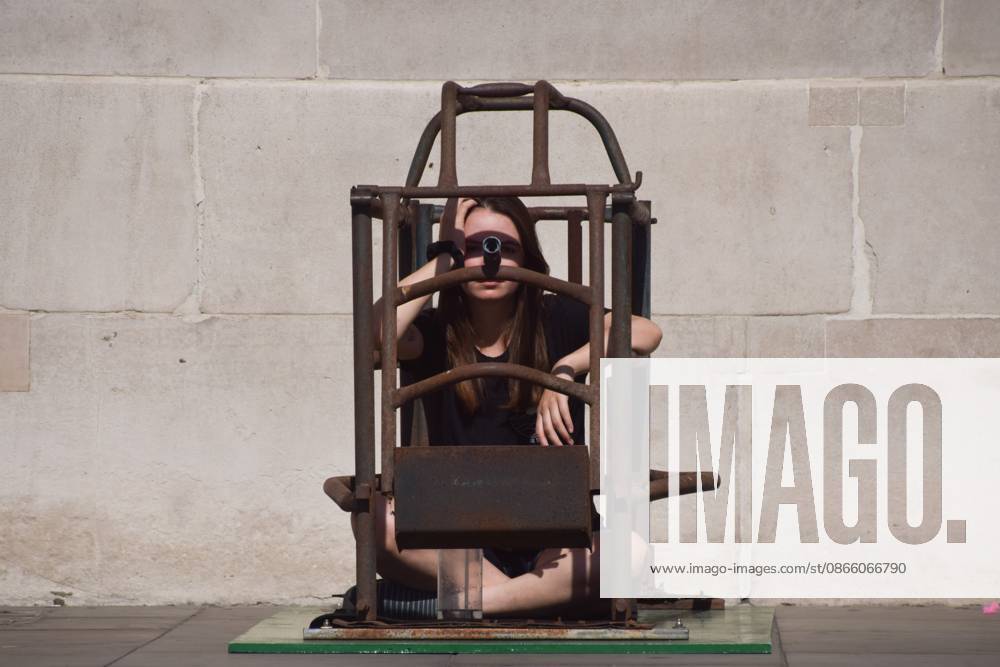 Activist Michelle Farnham sits inside a farrowing crate in Trafalgar Square on the sixth day of the protest against farrowing crates and factory farming organised by the animal rights group Animal Rising..The activist plans to spend a total of three weeks in the cramped crate, demonstrating how mother pigs live on factory farms. London United Kingdom - ZUMAs197 20260906_aaa_s197_035