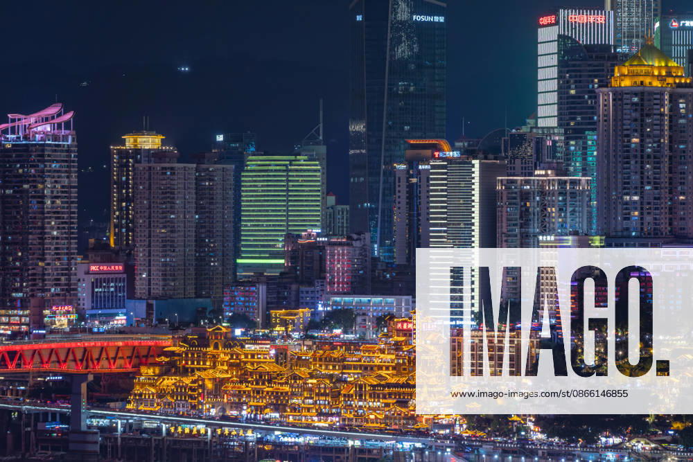 Skyline the City Chongqing with the at night illuminated Hongyadong Architekturkomplex 1127506213