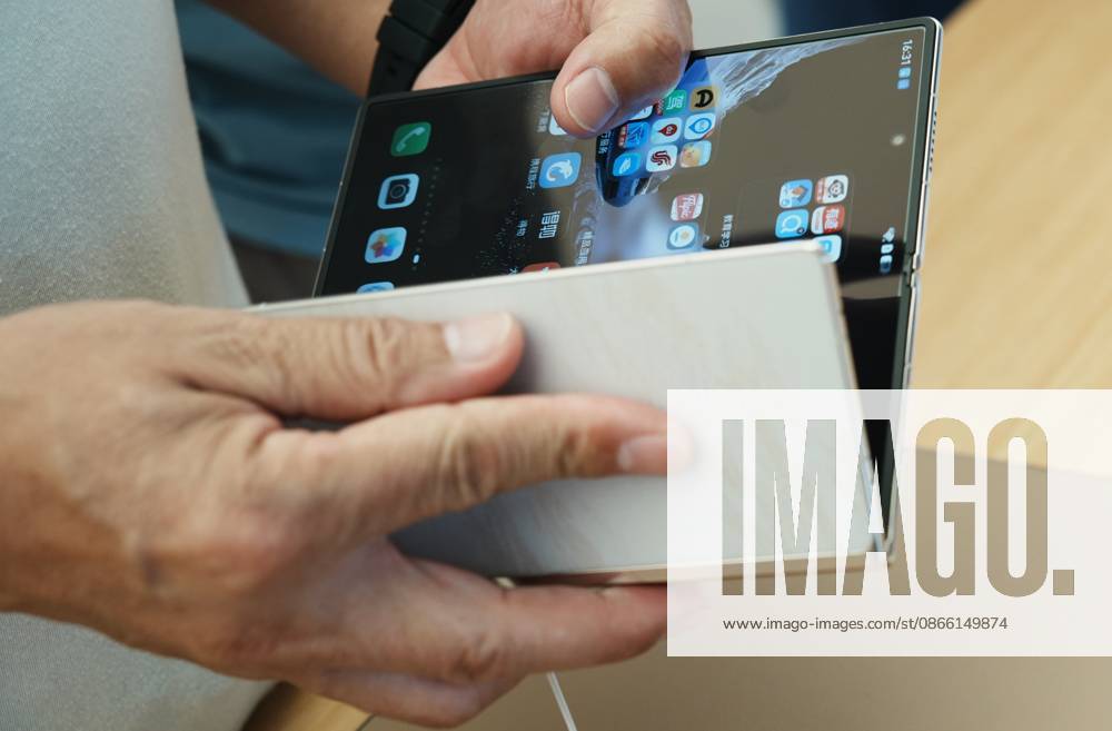 HUAWEI Mate XT 2 Smartphone A customer experiences a Huawei triple folding phone Mate XT 2 equipped with a high-performance chip Kirin 9050 Pro using logic folding technology (¦Ó law) at a Huawei store in Hangzhou, Zhejiang Province, China on September 7, 2026. Hangzhou Zhejiang China