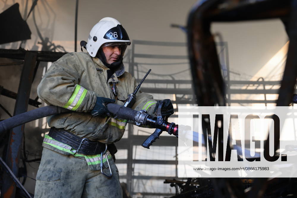 RUSSIA, MARIUPOL - SEPTEMBER 7, 2026: A Russia s Emergencies Ministry employee responds to a fire caused by a Ukrainian drone strike on the Galaktika shopping centre. Dmitry Yagodkin TASS 97290938
