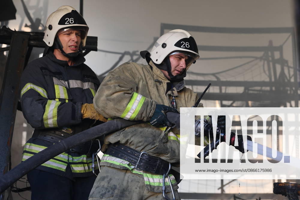 RUSSIA, MARIUPOL - SEPTEMBER 7, 2026: Russia s Emergencies Ministry employees respond to a fire caused by a Ukrainian drone strike on the Galaktika shopping centre. Dmitry Yagodkin TASS 97290942