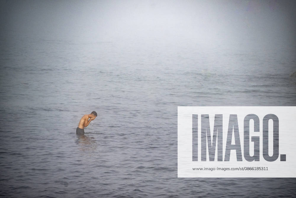 Settlements Continue on El Trampolín Beach A migrant takes a bath on El Trampolín Beach, September 7, 2026, in Ceuta, Spain. Despite having been cleared, the camp on El Trampolín Beach resembles a makeshift city and remains occupied by people who continue to arrive in Ceuta. SEPTEMBER 7, 2026, Ceuta, Spain
