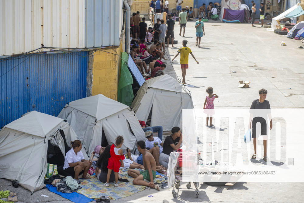 Migration Situation in the Tarajal Warehouses in Ceuta: Migrants living in one of the Tarajal warehouses, as of September 7, 2026, in Ceuta, Spain. The government has taken control of the port of Ceuta to provide humanitarian assistance to migrants in tents and other spaces. Specifically, the department led by Óscar Puente authorizes the Secretary of State for Migration to temporarily use an area of 16,000 square meters of public port land. SEPTEMBER 7, 2026 Ceuta, Spain