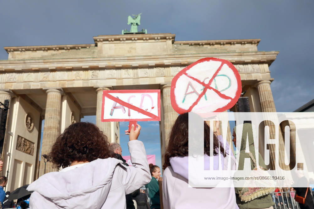 Participants holding cardboard signs protesting the AfD wait for the rally to begin. The rally, themed Time to Act: Stop the AfD, is scheduled to take place in Berlin at the Brande