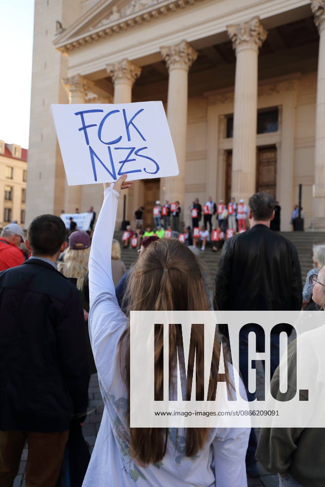 A protester holding a sign reading FCK NZS during a rally against the Alternative for Germany (AfD) party following its victory in the state election in Saxony-Anhalt, Alter Markt, Potsdam, September 7, 2026. Rally against the AfD in Potsdam