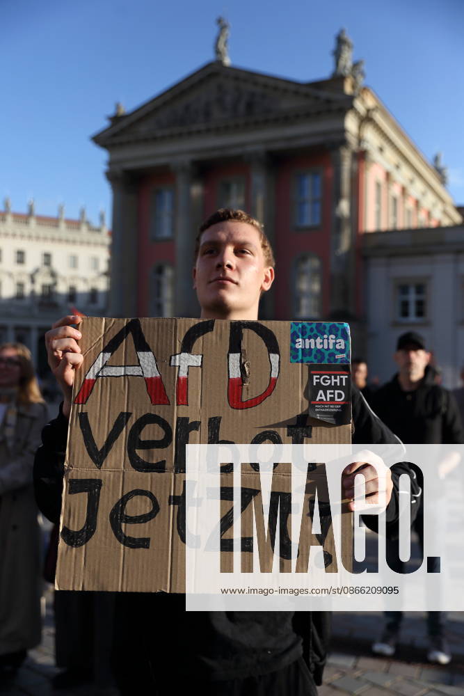 A protester holding a sign reading Ban the AfD Now during a rally against the Alternative for Germany (AfD) party following its victory in the state election in Saxony-Anhalt, Alter Markt, Potsdam, September 7, 2026. Rally against the AfD in Potsdam