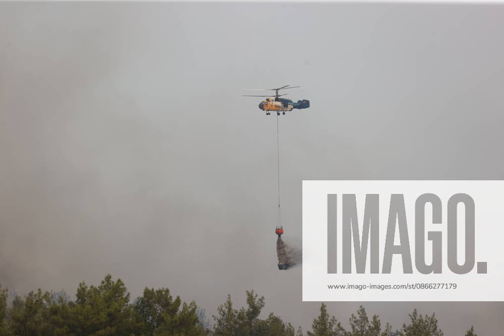 Wildfire breaks out in forested areas of Aksu and Kepez in Antalya ANTALYA, TURKIYE - SEPTEMBER 8: Firefighting teams battle a widespread wildfire spreading across forested areas in the Aksu and Kepez districts of Antalya, Turkiye, on September 8, 2026. Emergency crews deployed aircraft, water tenders, and ground personnel to conduct coordinated air and land containment operations as flames advanced rapidly through wooded terrain in the evening hours. Suleyman Elcin Anadolu Antalya Turkey. Editorial use only. Please get in touch for any other usage.