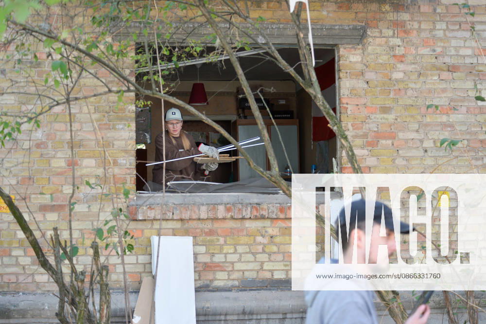 A woman removes the rubble in an apartment as seen through a window shattered by a Russian attack in the Solomianskyi district, Kyiv, Ukraine, September 8, 2026. On Tuesday night, September 8, Russian forces launched another massive strike on the Ukrainian capital with ballistic and cruise missiles, as well as jet UAVs. The attack caused significant damage to civilian infrastructure, residential areas, and business facilities. Three people were killed, and 19 were injured. (Photo by Oleksandr Klymenko Ukrinform) Destruction and fires reported across Kyiv districts after Russian attack
