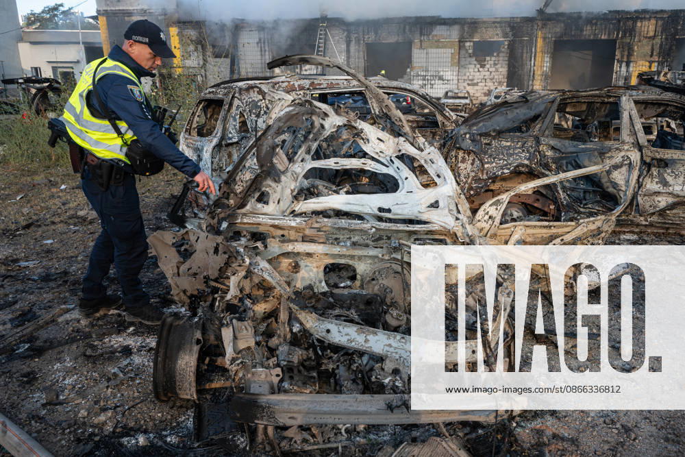 Destruction and fires reported across Kyiv districts after Russian attack A law enforcement officer examines a burnt-out car at a parking lot in the Podilskyi district of Kyiv, Ukraine, on September 8, 2026, following a Russian attack. On the night of September 8, Russian forces launched a strike on the Ukrainian capital using ballistic and cruise missiles and jet unmanned aerial vehicles. The attack caused damage to civilian infrastructure, residential areas, and business facilities. Three people were killed, and 19 were injured. Kyiv Ukraine