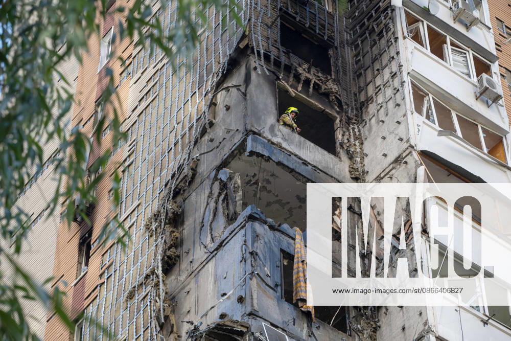 A State Emergency Service rescue worker looks out of a window in a 24-storey apartment block damaged by a Russian attack in the Darnytskyi district of Kyiv, Ukraine, September 9, 2026. On Wednesday morning, September 9, a Russian drone hit the 24-storey building on the 12th floor. According to police, five people were injured, including a pregnant woman. (Photo by Danylo Antoniuk Ukrinform) Apartment block hit by Russian drone in Kyiv