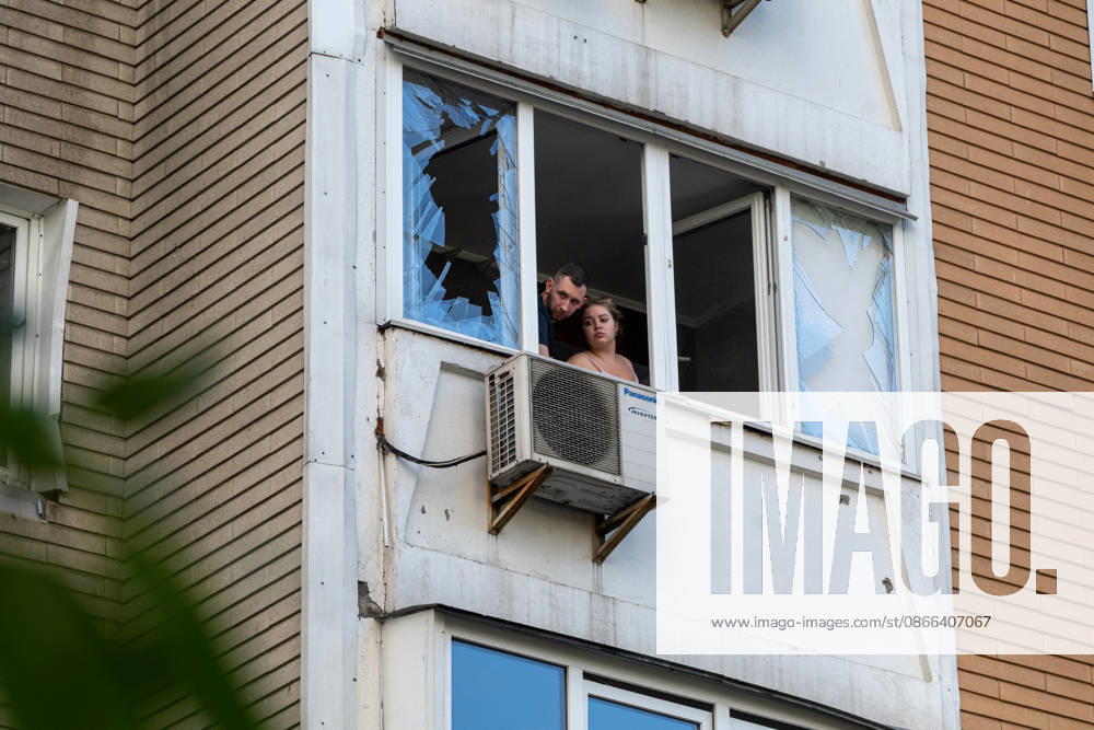 A man and a woman look out from a balcony in a 24-storey apartment block damaged by a Russian attack in the Darnytskyi district of Kyiv, Ukraine, September 9, 2026. On Wednesday morning, September 9, a Russian drone hit the 24-storey building on the 12th floor. According to police, five people were injured, including a pregnant woman. (Photo by Danylo Antoniuk Ukrinform) Apartment block hit by Russian drone in Kyiv