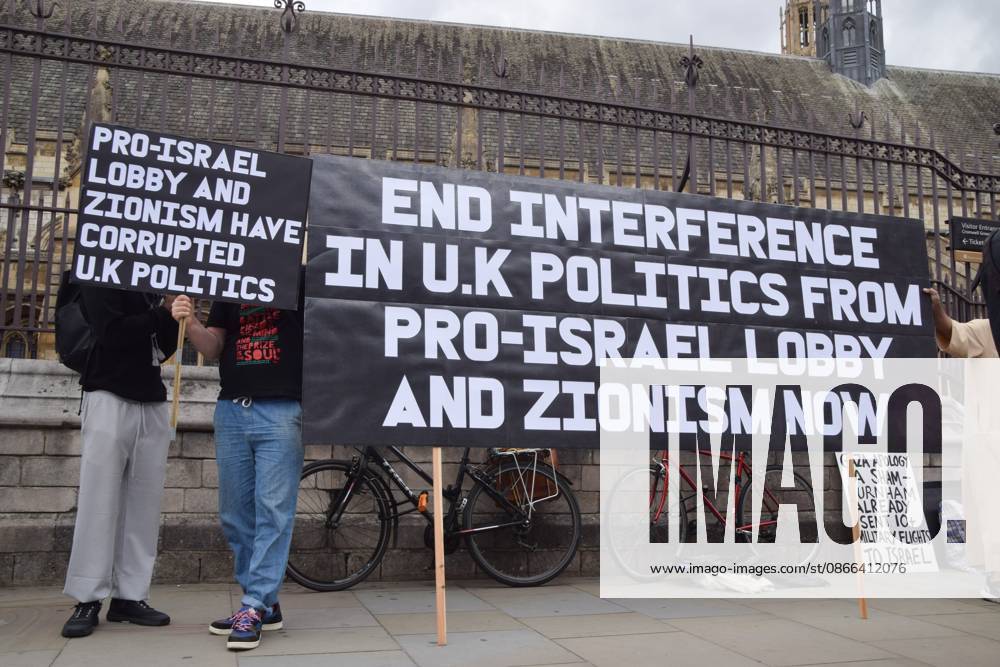 Protesters hold a banner and a placard opposed to the interference in UK politics from the pro-Israel lobby and Zionism during the demonstration..Protesters gathered in Parliament Square in support of Palestine and against what the protesters call a pro-Israel and Zionist influence in UK politics. London United Kingdom - ZUMAs197 20260909_aaa_s197_111