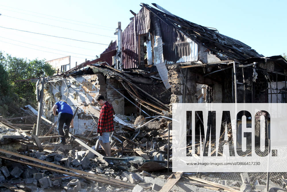Aftermath of Russian drone attack in Dnipro People inspect a private house destroyed in a Russian drone attack in Dnipro, Ukraine, on September 9, 2026. On Wednesday night, September 9, Russian drones struck the eastern Ukrainian city. The attack caused fires at warehouses storing building materials and at a private house. Rescuers freed three people, including a 15-year-old boy, from the basement of the damaged home. A 51-year-old man and a 52-year-old woman were taken to hospital. Dnipro Ukraine