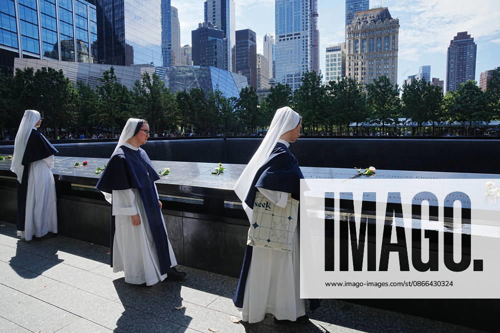 Sisters from New York s Sisters of Life look over the North Tower reflecting pool ahead of the 25th anniversary of the attacks of September 11 at the 9 11 Memorial on September 9, 2026 in New York. New York USA - ZUMAb148 20260909_zap_b148_001