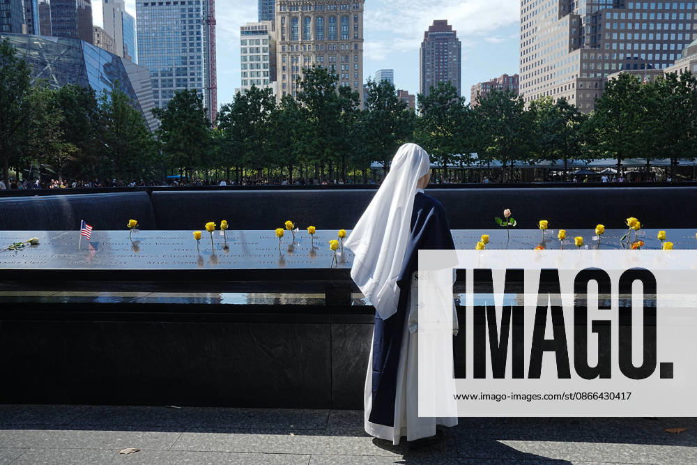 A Sister from New York s Sisters of Life looks over the North Tower reflecting pool ahead of the 25th anniversary of the attacks of September 11 at the 9 11 Memorial on September 9, 2026 in New York. New York USA - ZUMAb148 20260909_zap_b148_003