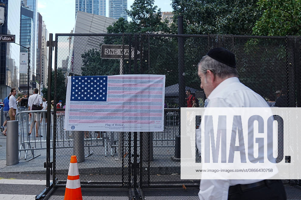 A man walks past a Flag of Honor on a security fence ahead of the 25th anniversary of the attacks of September 11 at the 9 11 Memorial in lower Manhattan on September 9, 2026 in New York. New York USA - ZUMAb148 20260909_zap_b148_017