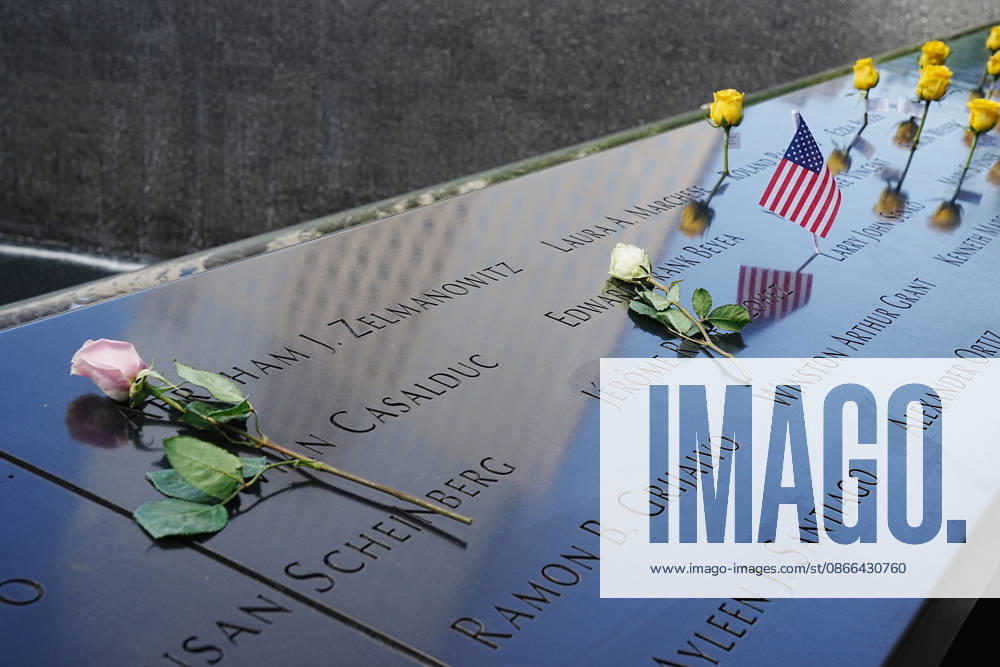 Roses and an American flag with victims names along the North Tower reflecting pool ahead of the 25th anniversary of the attacks of September 11 at the 9 11 Memorial on September 9, 2026 in New York. New York USA - ZUMAb148 20260909_zap_b148_018