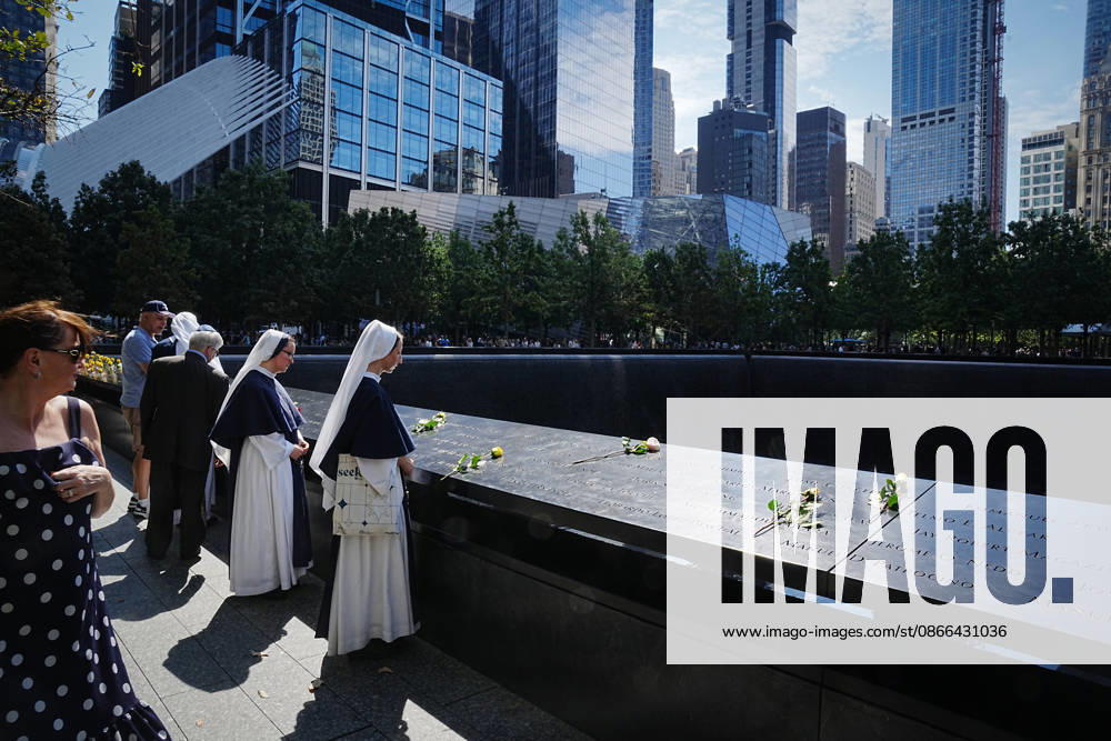 Sisters from New York s Sisters of Life look over the North Tower reflecting pool ahead of the 25th anniversary of the attacks of September 11 at the 9 11 Memorial on September 9, 2026 in New York. New York USA - ZUMAb148 20260909_zap_b148_022