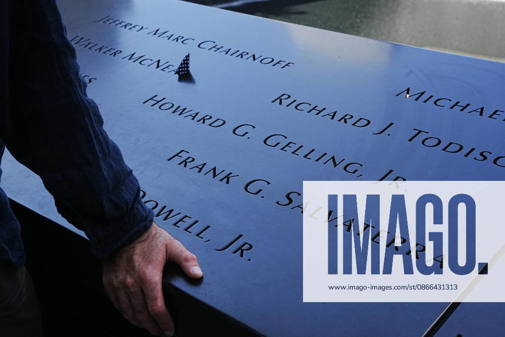 Visitors look over the South Tower reflecting pool ahead of the 25th anniversary of the attacks of September 11 at the 9 11 Memorial on September 9, 2026 in New York. New York USA - ZUMAb148 20260909_zap_b148_065