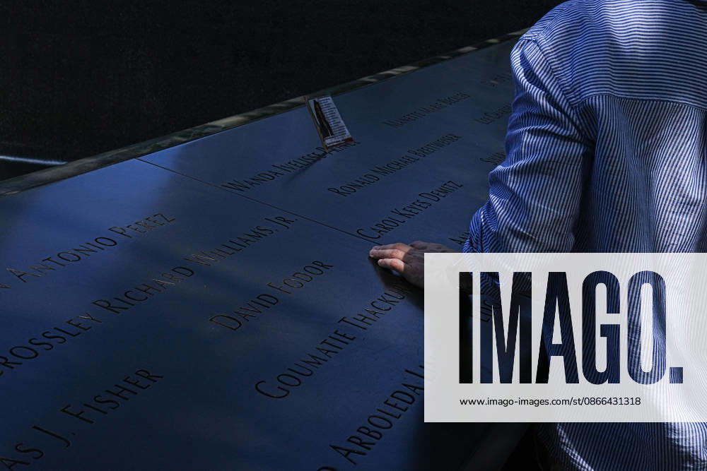 Visitors look over the South Tower reflecting pool ahead of the 25th anniversary of the attacks of September 11 at the 9 11 Memorial on September 9, 2026 in New York. New York USA - ZUMAb148 20260909_zap_b148_038