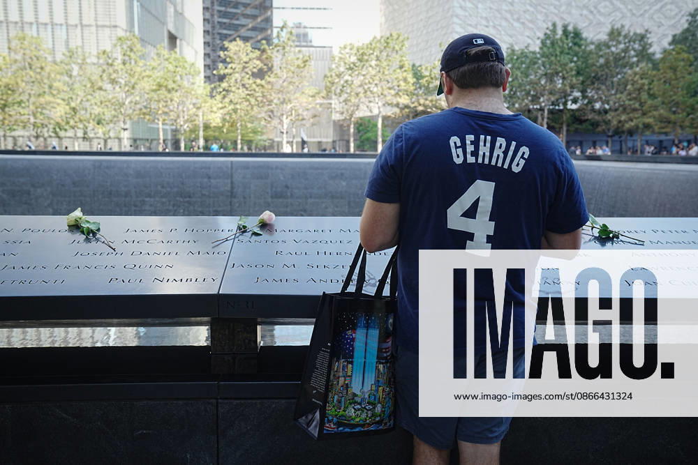 A visitor looks over the South Tower reflecting pool ahead of the 25th anniversary of the attacks of September 11 at the 9 11 Memorial on September 9, 2026 in New York. New York USA - ZUMAb148 20260909_zap_b148_071
