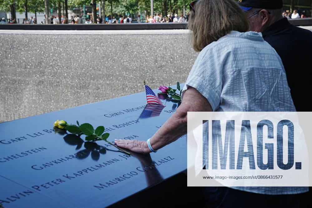 Family members look over the South Tower reflecting pool ahead of the 25th anniversary of the attacks of September 11 at the 9 11 Memorial on September 9, 2026 in New York. New York USA - ZUMAb148 20260909_zap_b148_045
