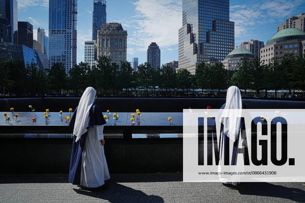Sisters from New York s Sisters of Life look over the North Tower reflecting pool ahead of the 25th anniversary of the attacks of September 11 at the 9 11 Memorial on September 9, 2026 in New York. New York USA - ZUMAb148 20260909_zap_b148_054