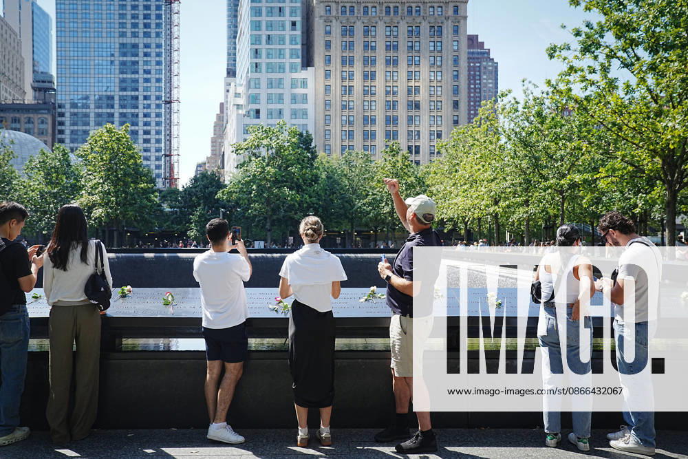 Visitors look over the South Tower reflecting pool ahead of the 25th anniversary of the attacks of September 11 at the 9 11 Memorial on September 9, 2026 in New York. New York USA - ZUMAb148 20260909_zap_b148_056