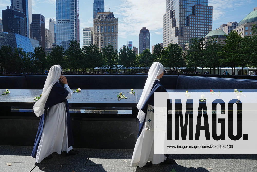 Sisters from New York s Sisters of Life look over the North Tower reflecting pool ahead of the 25th anniversary of the attacks of September 11 at the 9 11 Memorial on September 9, 2026 in New York. New York USA - ZUMAb148 20260909_zap_b148_061