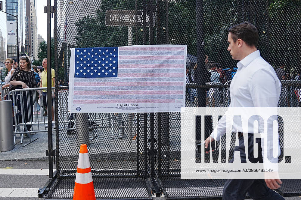 A man walks past a Flag of Honor on a security fence ahead of the 25th anniversary of the attacks of September 11 at the 9 11 Memorial in lower Manhattan on September 9, 2026 in New York. New York USA - ZUMAb148 20260909_zap_b148_067
