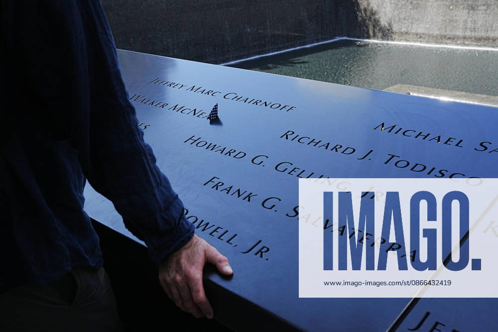 Visitors look over the South Tower reflecting pool ahead of the 25th anniversary of the attacks of September 11 at the 9 11 Memorial on September 9, 2026 in New York. New York USA - ZUMAb148 20260909_zap_b148_074
