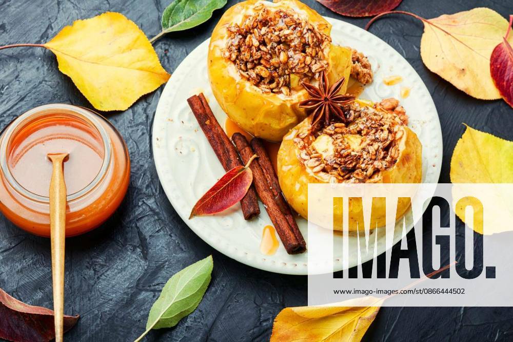 Baked apples stuffed with granola and nuts.Baking concept
